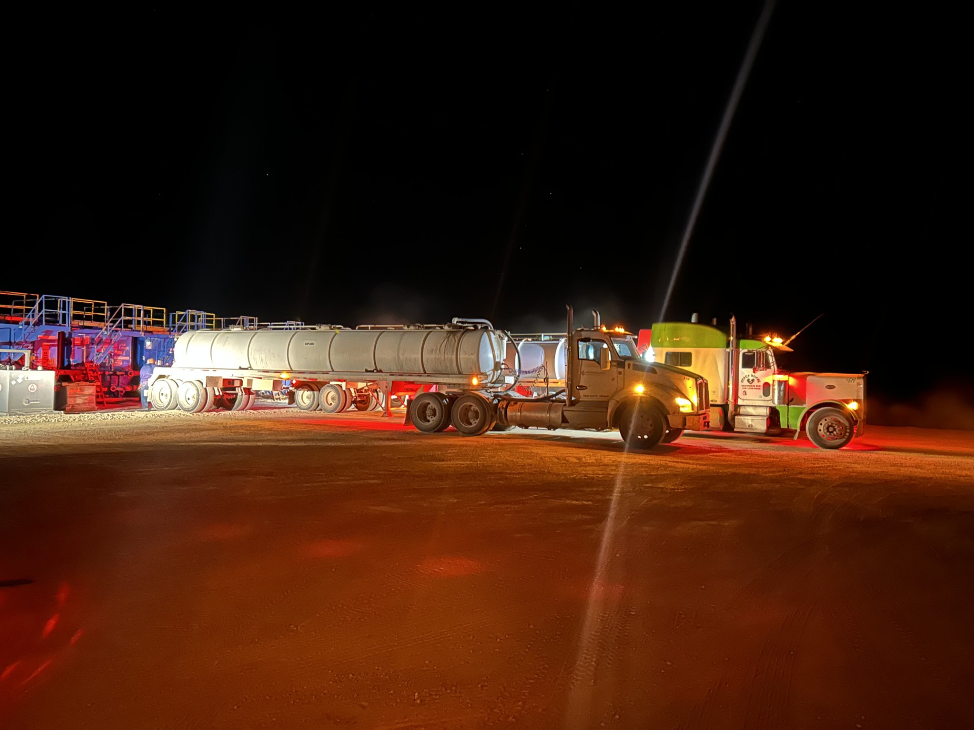 Trucks working on location at night